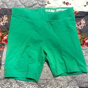 Green biker shorts.